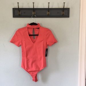 Lulu’s Modernization Coral Pink Bodysuit